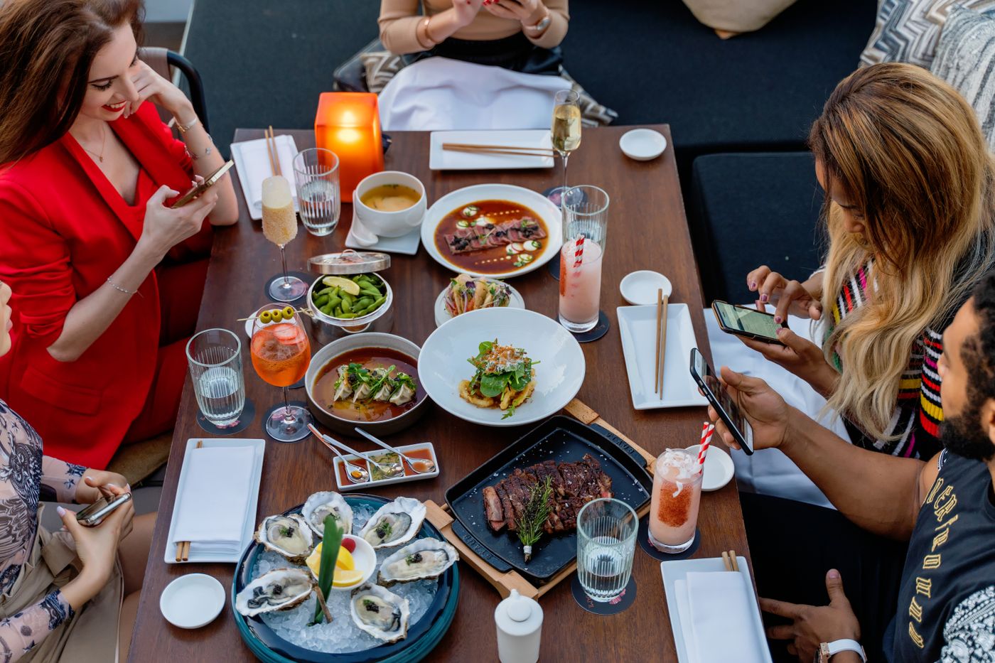 Friends enjoying a meal together at a real restaurant